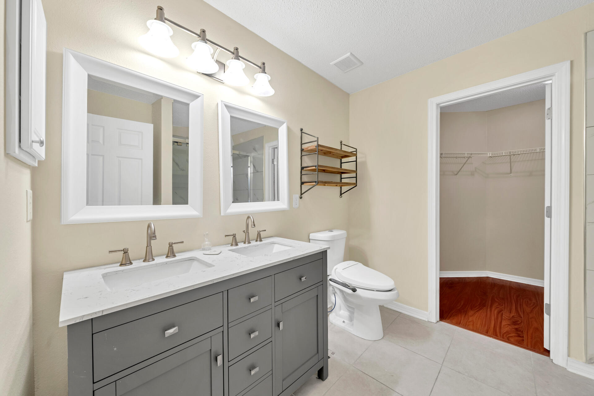 246 Bayou Landing Road Santa Rosa Beach, FL 32459 - Photo 14 of 29 a bathroom with a double vanity sink toilet and mirror