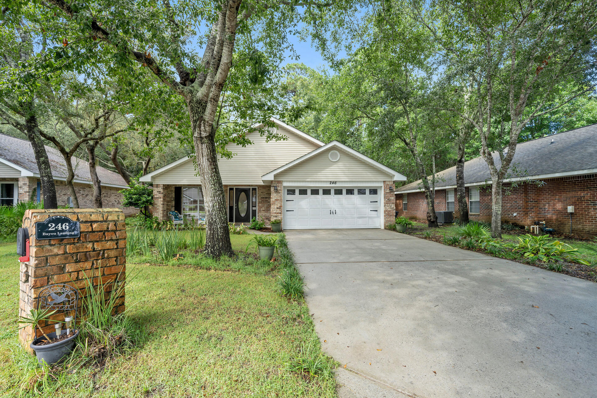 246 Bayou Landing Road Santa Rosa Beach, FL 32459 - Photo 25 of 29 a view of a house with garden