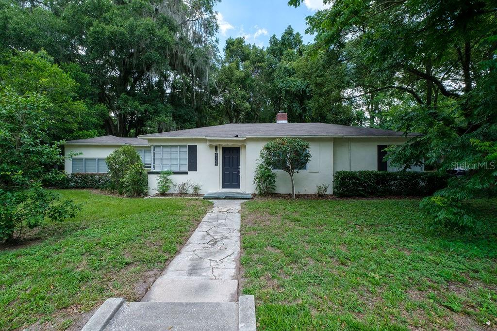 2706 West University Avenue Gainesville, FL 32607 - Photo 1 of 1 a front view of a house with a yard
