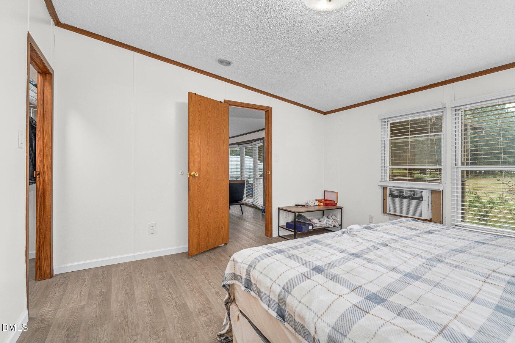 1835 Cokey Road Rocky Mount, NC 27801 - Photo 13 of 42 a bedroom with a bed and a large window
