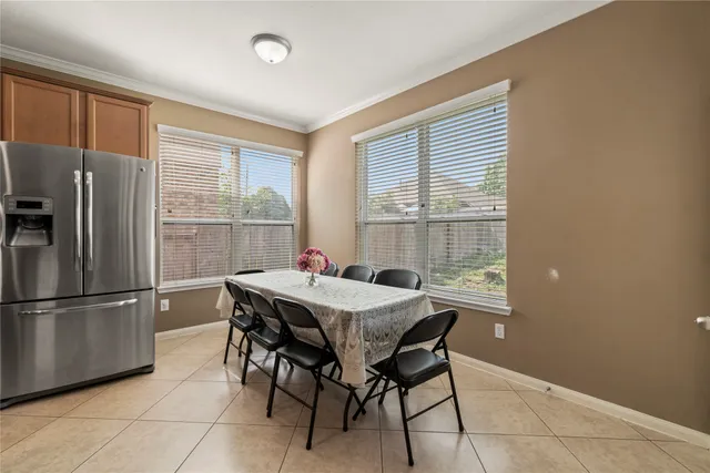 a dining room with furniture and window