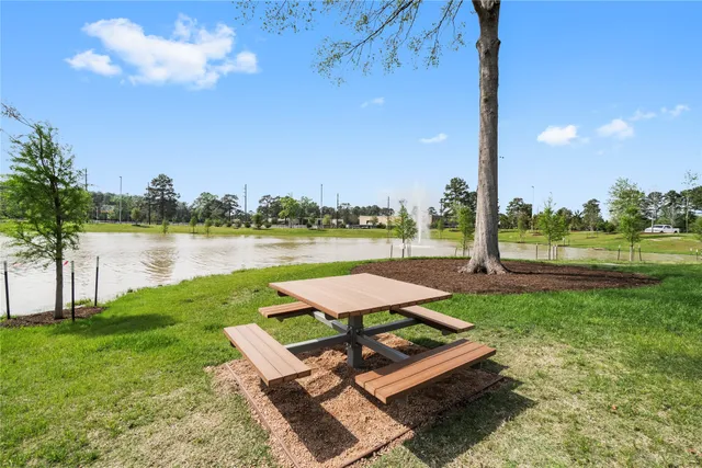 a view of a patio with a table and chairs