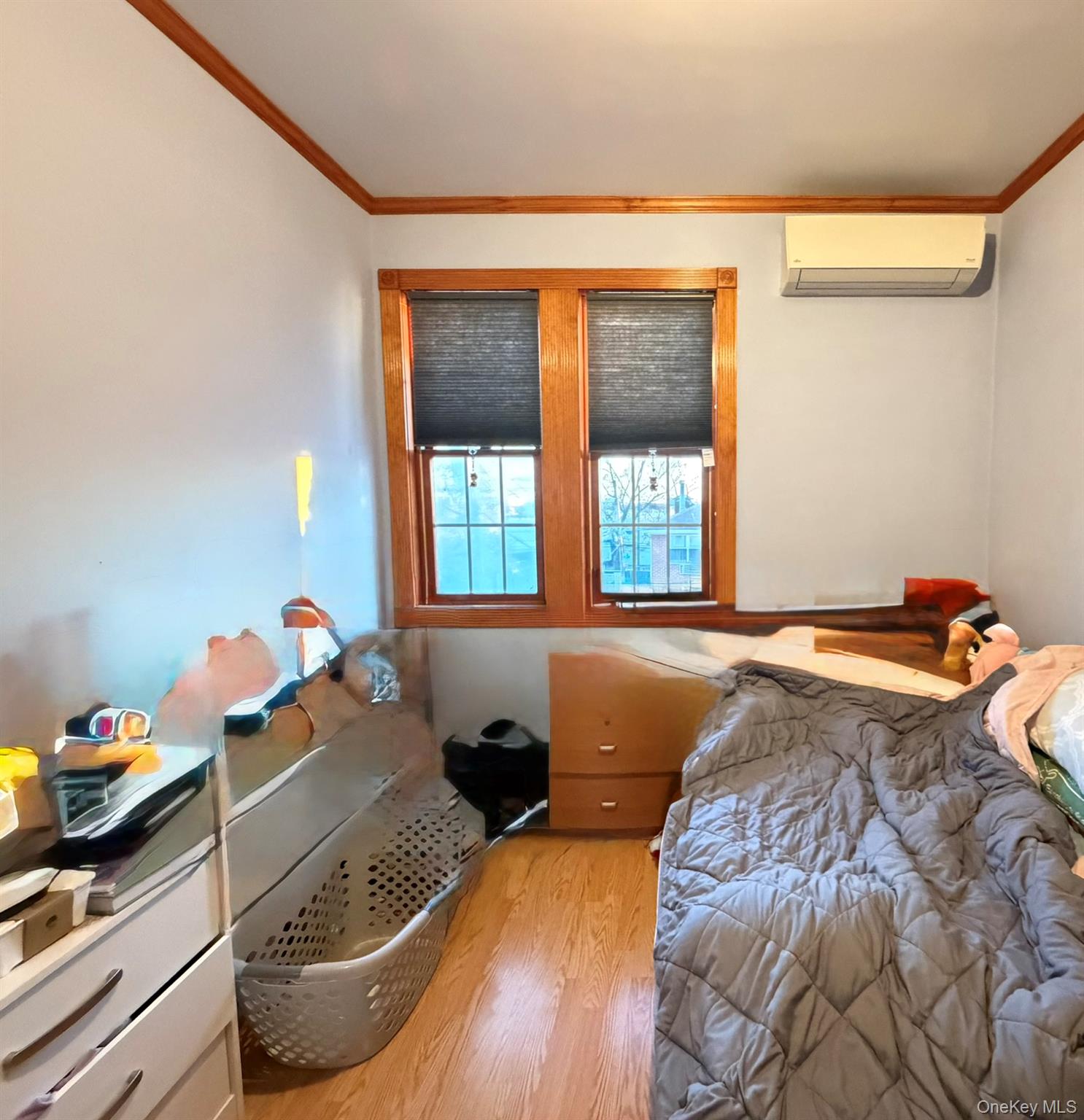 111-20 14th Road Queens, NY 11356 - Photo 7 of 13 a bedroom with bed and window