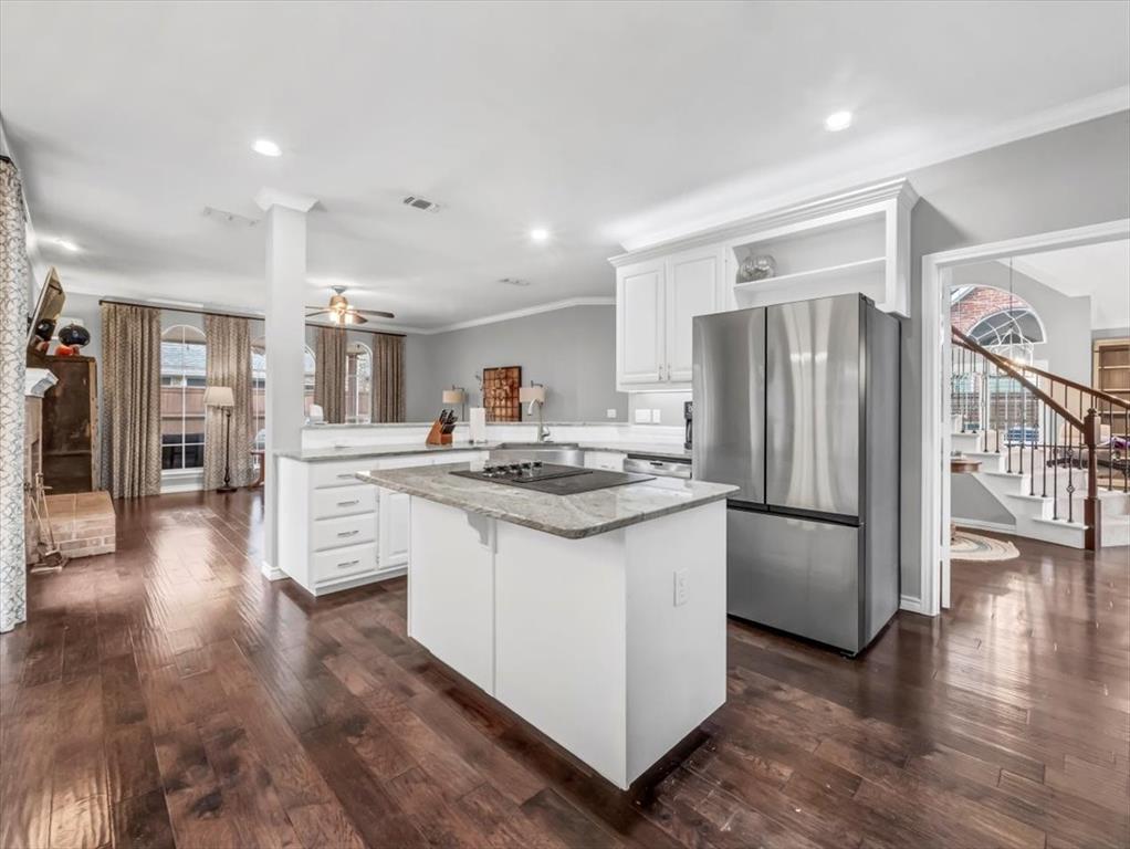 1402 Crown Point Road McKinney, TX 75072 - Photo 1 of 1 a kitchen with stainless steel appliances a refrigerator a sink and a stove top oven