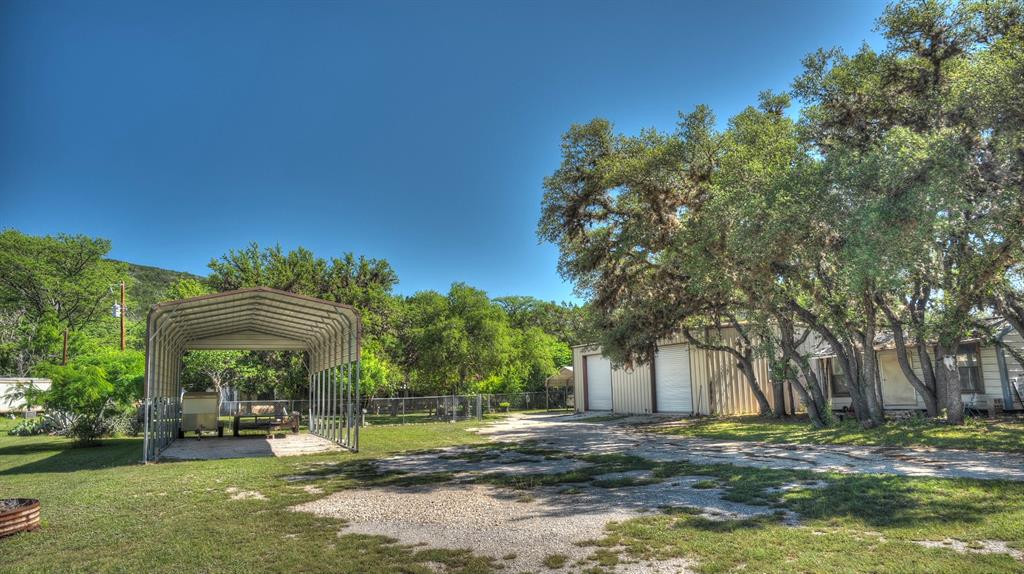 187 Roy Chisum Road Leakey, TX 78873 - Photo 32 of 40 a view of a park with of a house in the background