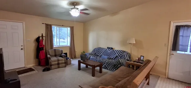 a living room with furniture and a window