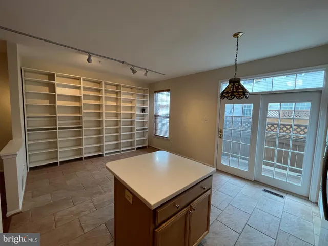 a view of a room with cabinet and windows