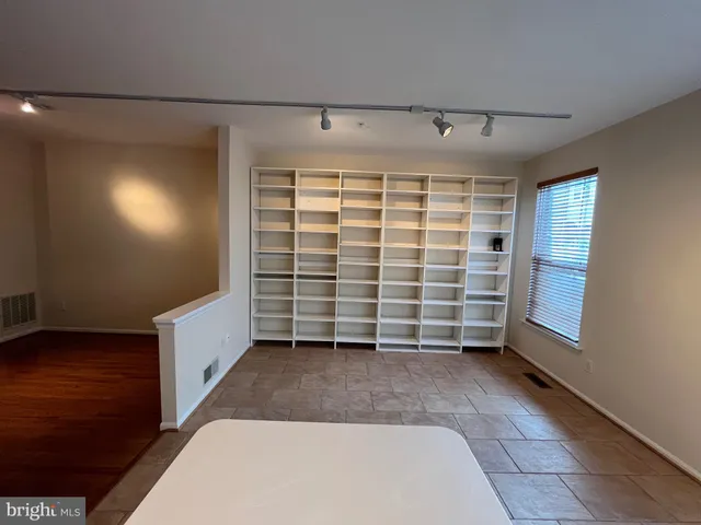 a view of empty room with a garage