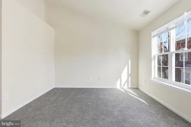 a view of empty room with windows