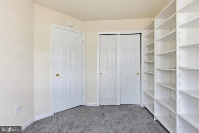 a view of an empty room with shelves
