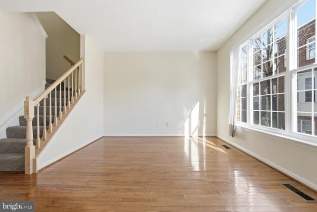 a view of an entryway with wooden floor