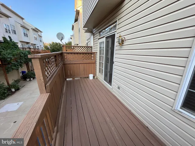 a view of a balcony with wooden floor