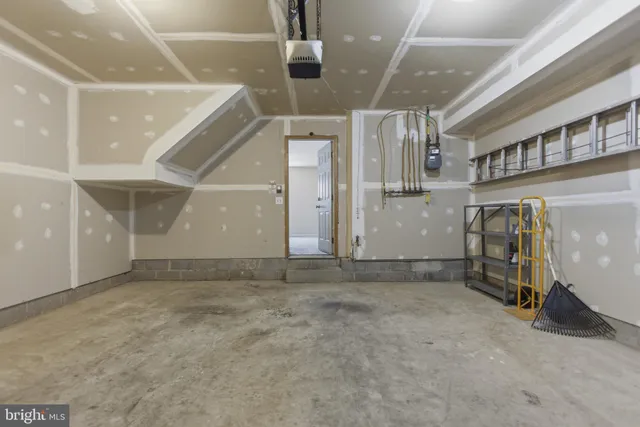 a view of a house with wooden fence