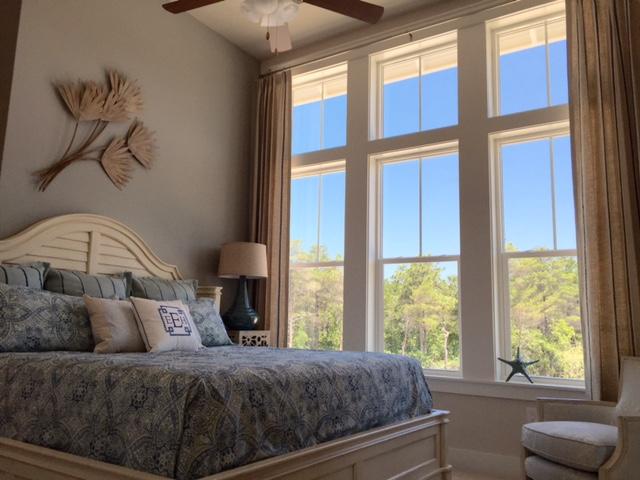 25 W Pine, Unit B Inlet Beach, FL 32461 - Photo 16 of 44 a bedroom with a bed and a window