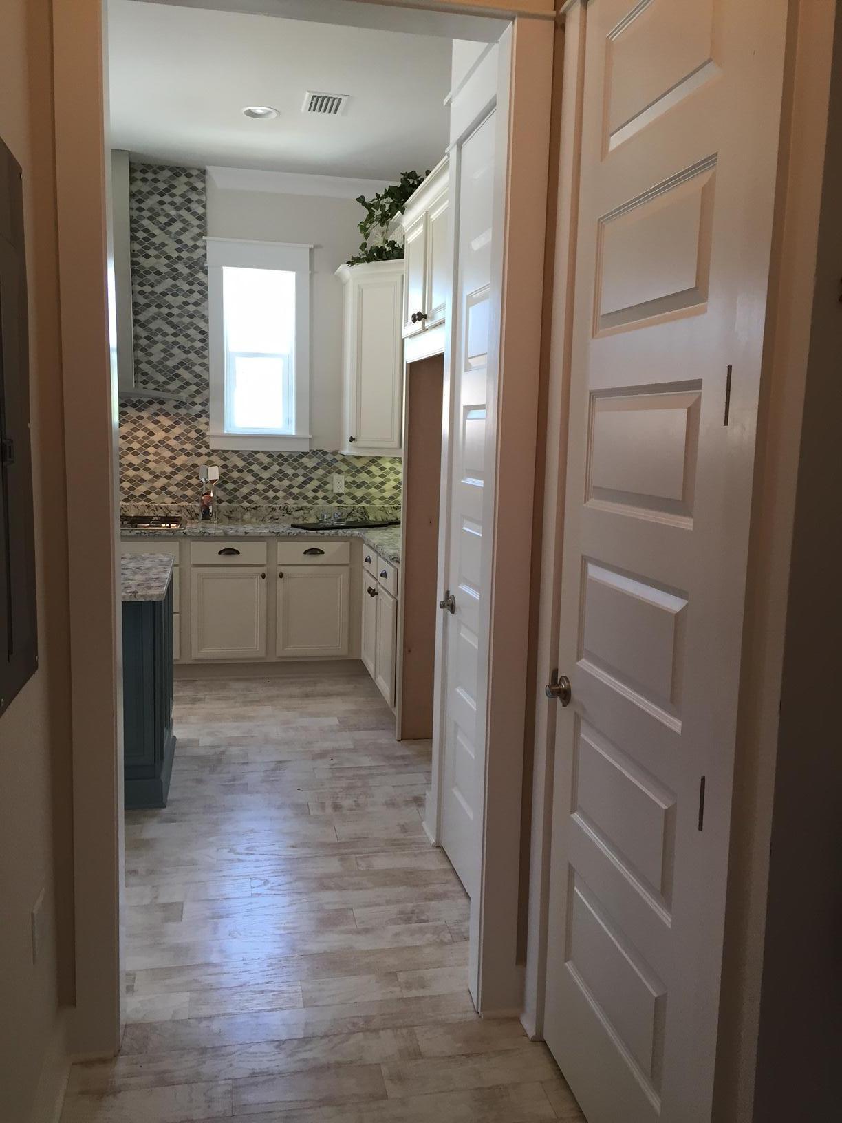 25 W Pine, Unit B Inlet Beach, FL 32461 - Photo 17 of 44 a bathroom with a granite countertop sink mirror and a toilet