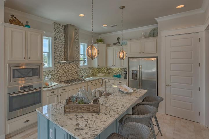 25 W Pine, Unit B Inlet Beach, FL 32461 - Photo 20 of 44 a kitchen with kitchen island granite countertop a counter space cabinets and stainless steel appliances