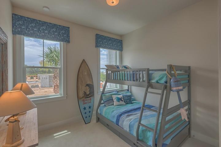 25 W Pine, Unit B Inlet Beach, FL 32461 - Photo 21 of 44 a bedroom with furniture and a window