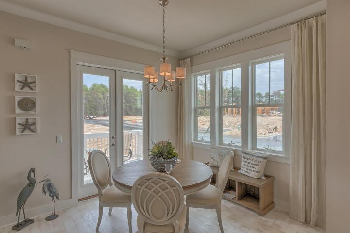 25 W Pine, Unit B Inlet Beach, FL 32461 - Photo 25 of 44 a view of a dining room with furniture window and outside view