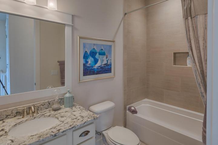 25 W Pine, Unit B Inlet Beach, FL 32461 - Photo 28 of 44 a bathroom with a granite countertop sink toilet and shower