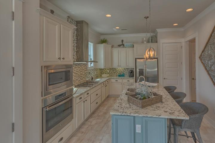 25 W Pine, Unit B Inlet Beach, FL 32461 - Photo 30 of 44 a kitchen with stainless steel appliances granite countertop a sink and cabinets