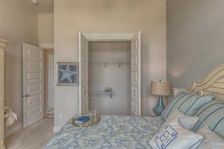 25 W Pine, Unit B Inlet Beach, FL 32461 - Photo 37 of 44 a bedroom with a bed and a mirror