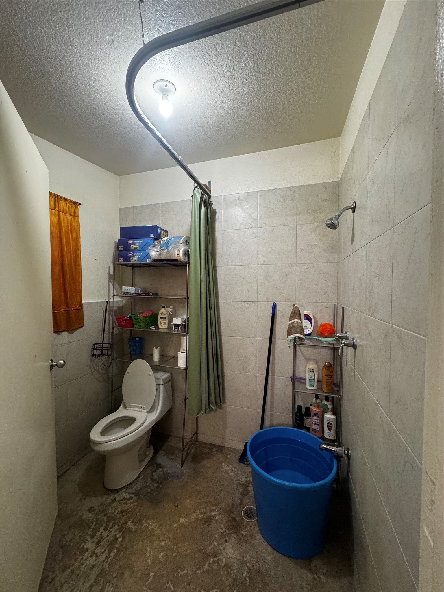 317 12th Street Palacios, TX 77465 - Photo 19 of 31 a bathroom with a toilet a sink and a mirror