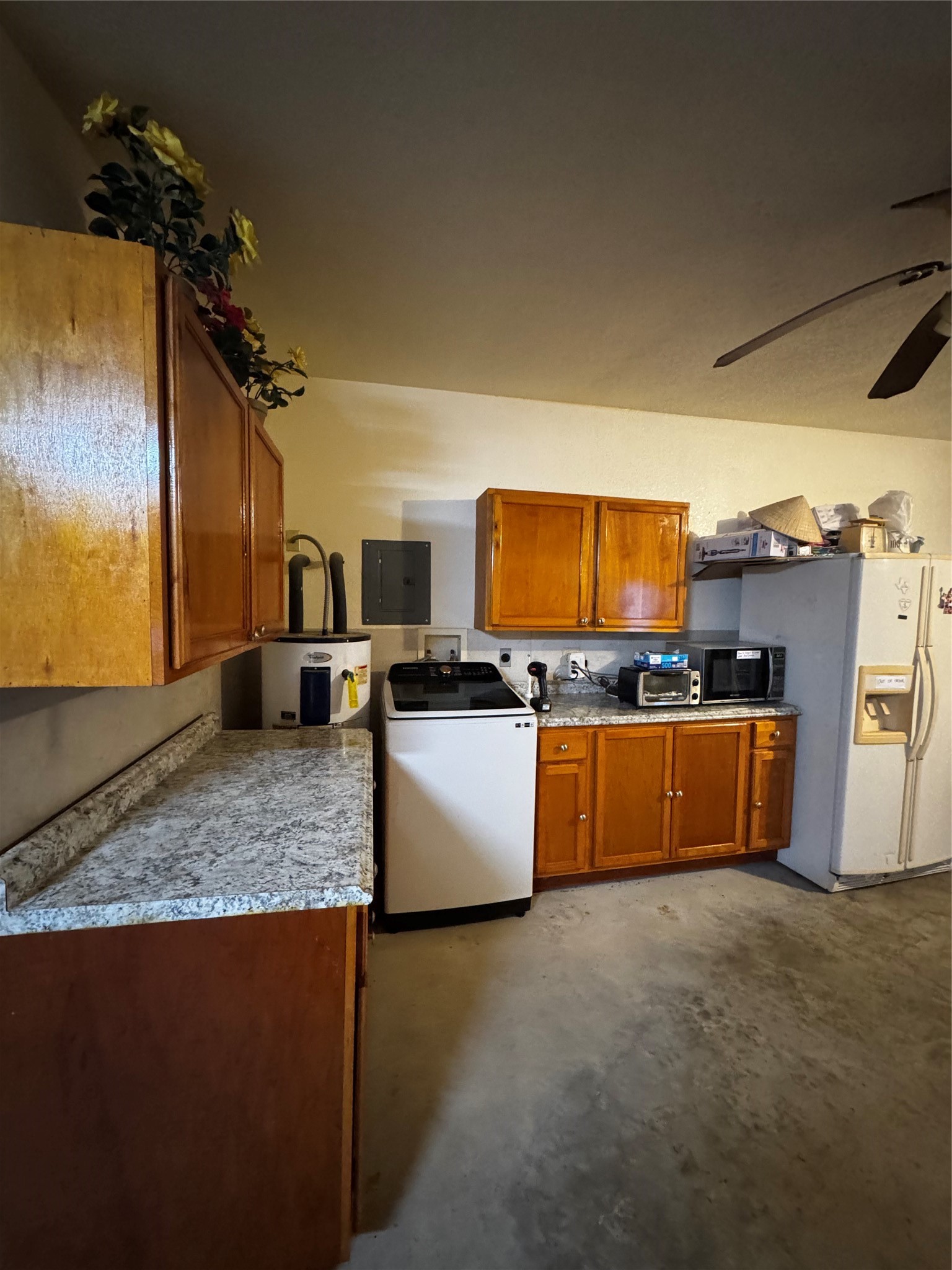 317 12th Street Palacios, TX 77465 - Photo 20 of 31 a kitchen with stainless steel appliances granite countertop a stove a sink and a microwave