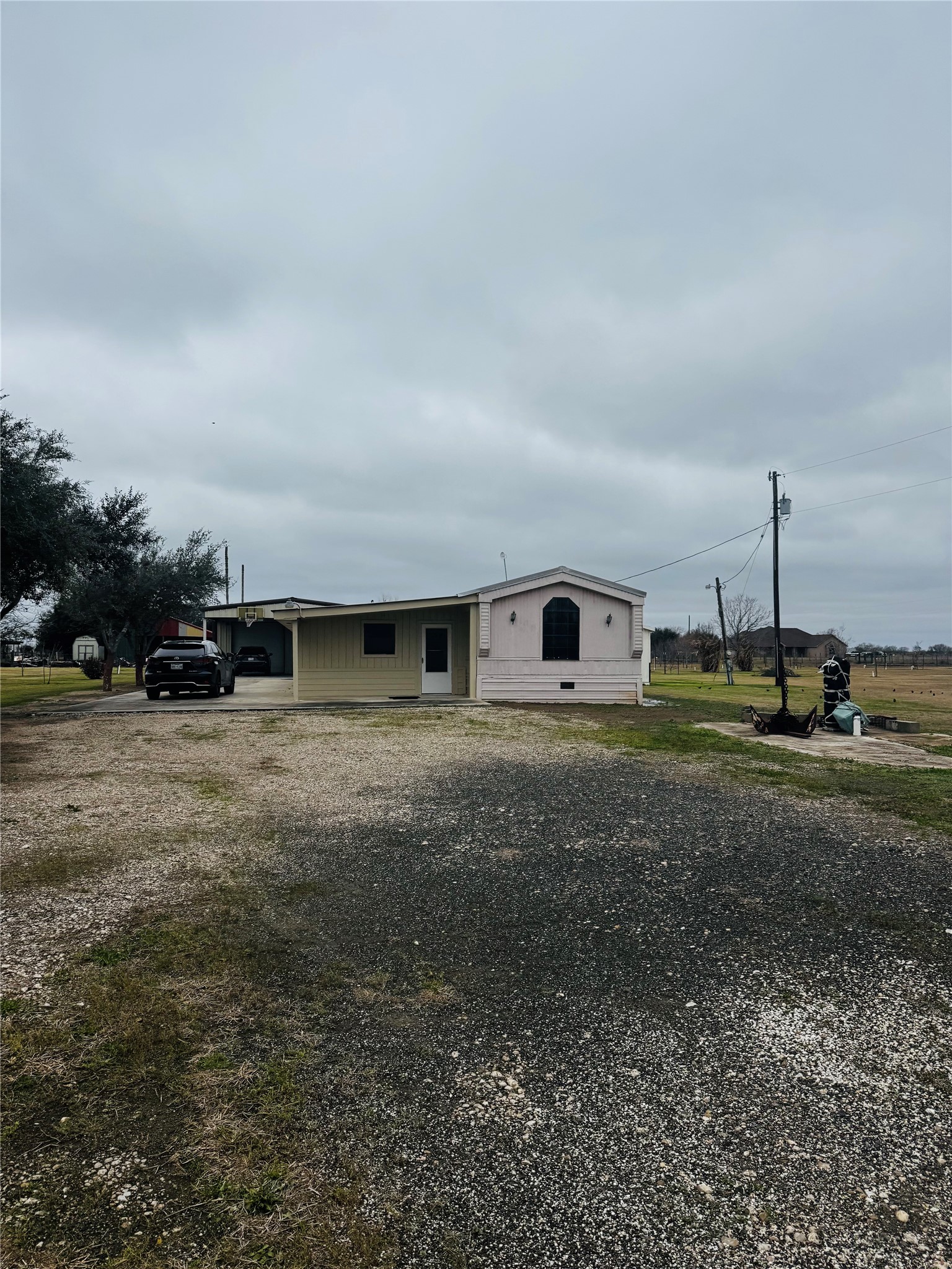 317 12th Street Palacios, TX 77465 - Photo 2 of 31 a front view of a house with a yard