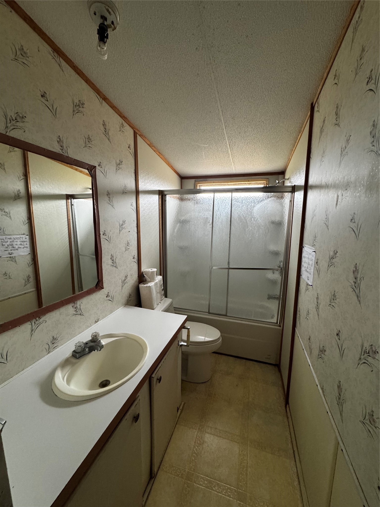 317 12th Street Palacios, TX 77465 - Photo 25 of 31 a bathroom with a sink toilet and shower