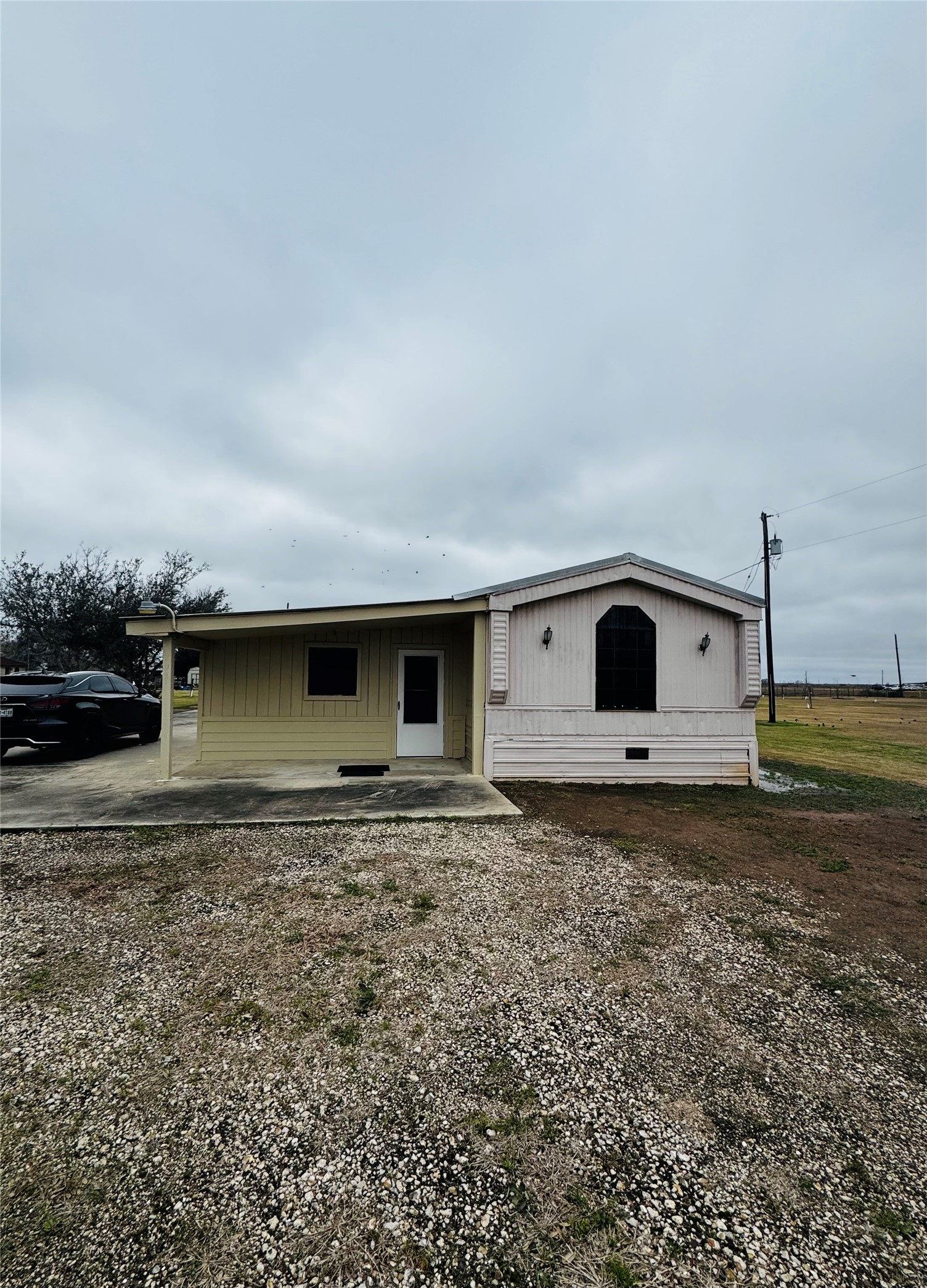 317 12th Street Palacios, TX 77465 - Photo 5 of 31 a front view of a house with a yard