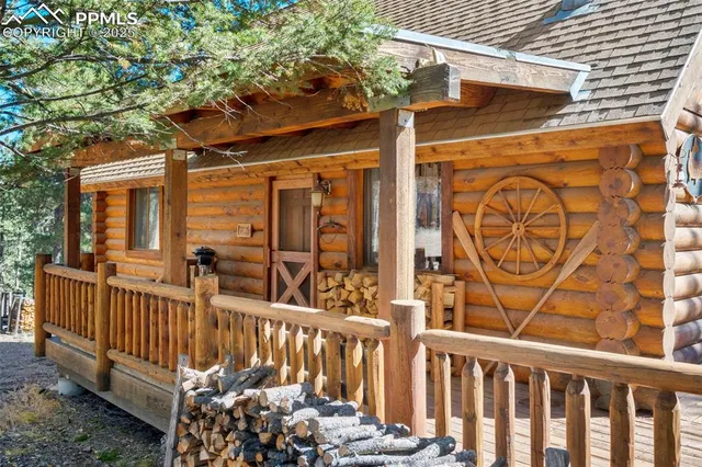a view of a porch with wooden fence