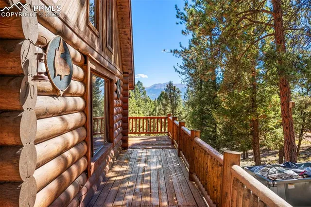 a view of balcony with wooden floor and fence