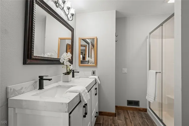 a bathroom with a sink and a mirror