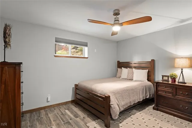 a bedroom with a bed and window