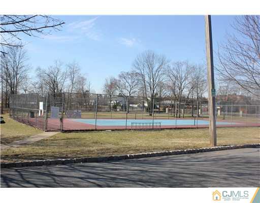 7208 Hana Road Edison, NJ 08817 - Photo 14 of 14 a view of a yard with wooden fence