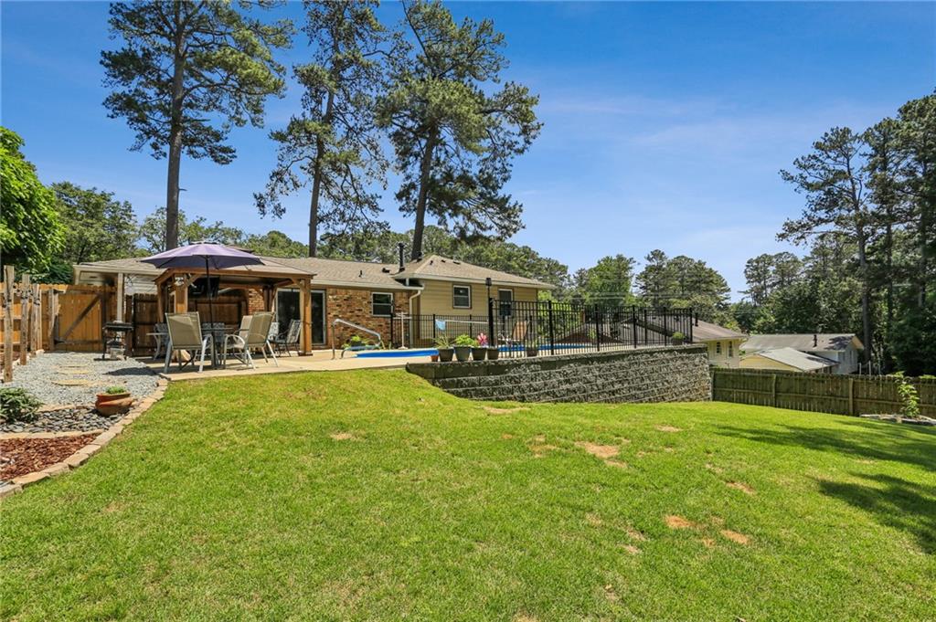 2740 Frontier Trail Atlanta, GA 30341 - Photo 8 of 29 a view of house with swimming pool and sitting area