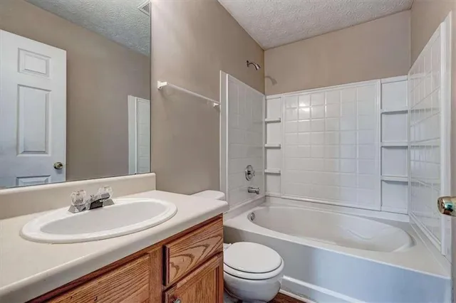 a bathroom with a sink toilet a bathtub and shower