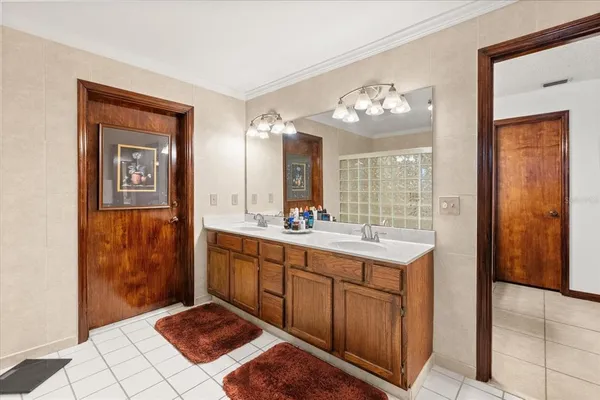 a bathroom with a double vanity sink and a mirror