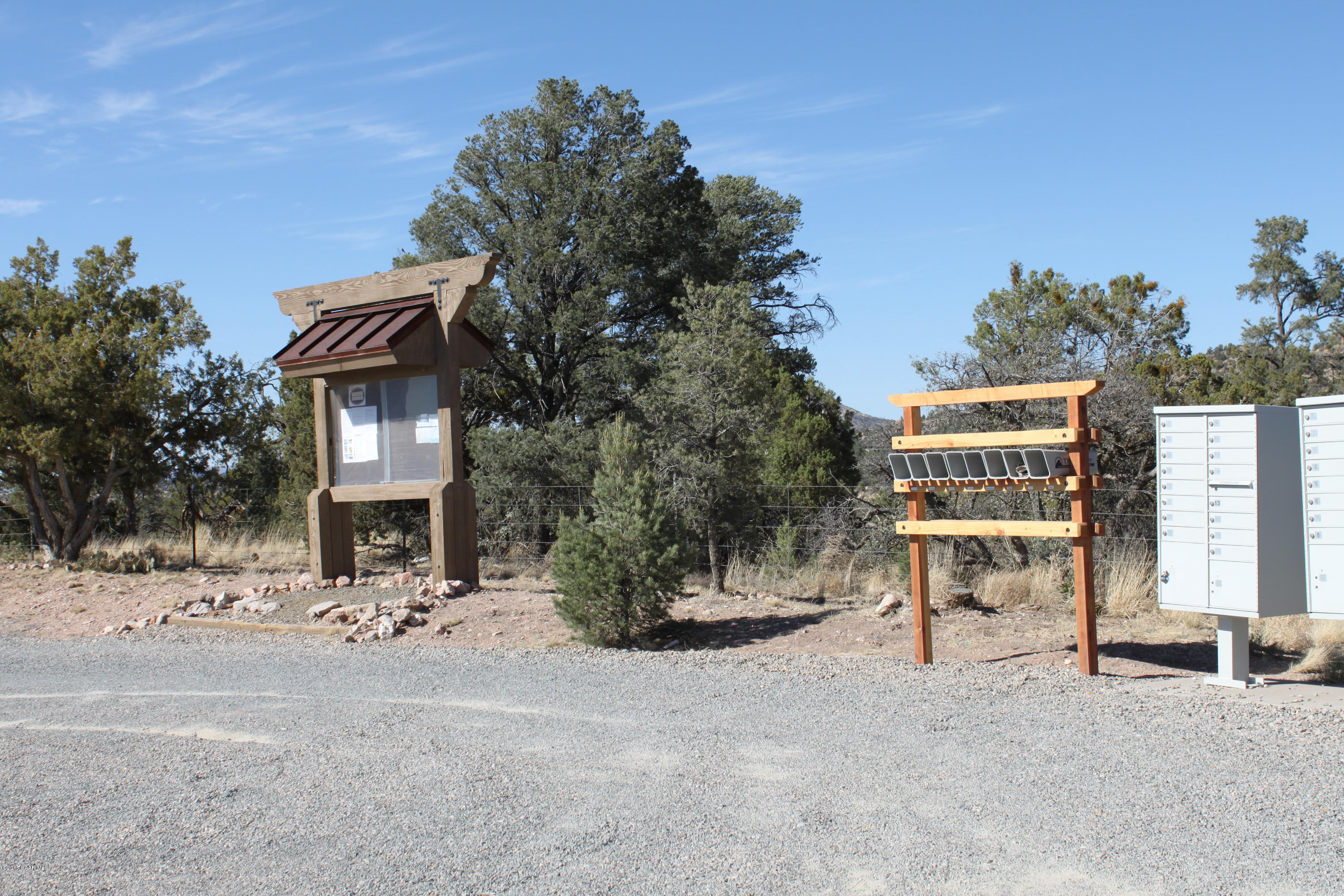 16101 Petroglyph Road Prescott, AZ 86305 - Photo 16 of 33 a view of a house with a yard and sitting area