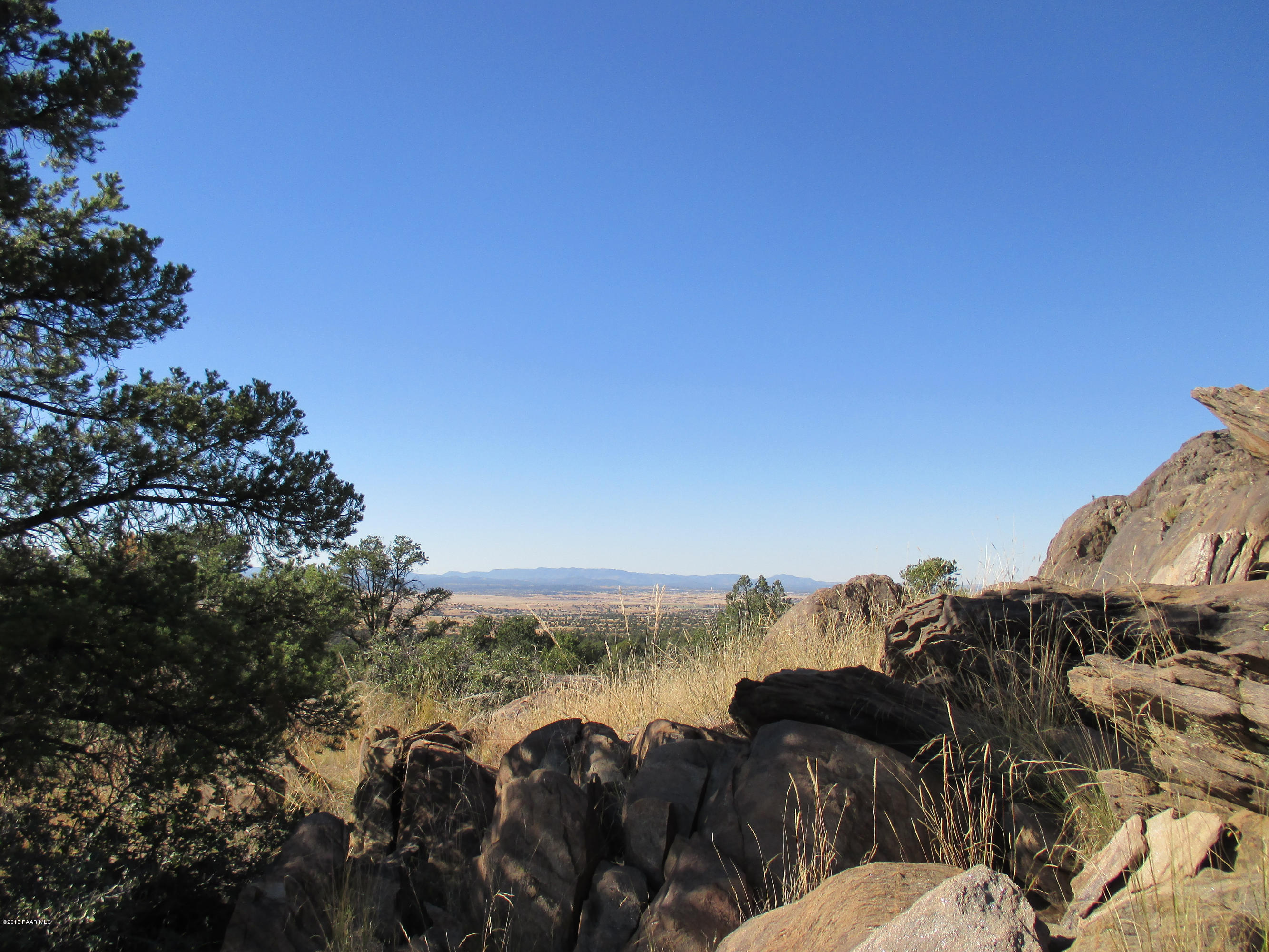 16101 Petroglyph Road Prescott, AZ 86305 - Photo 30 of 33 a view of a lake with a building in the background