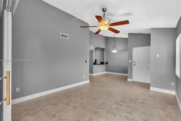 a view of an empty room with a window