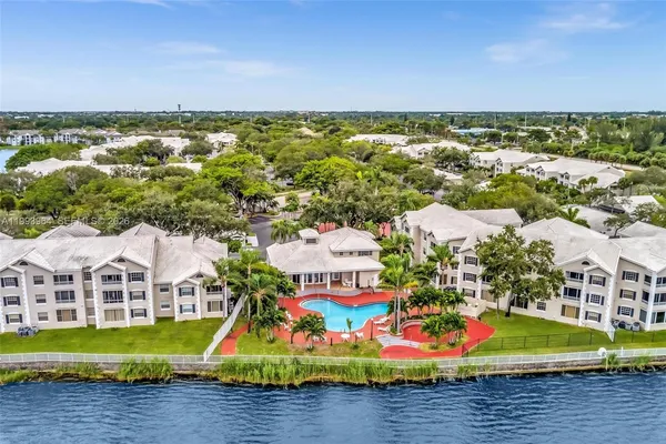 a view of a lake with a building in the background