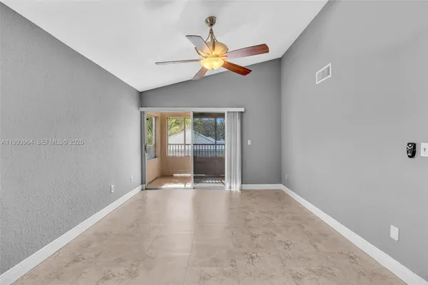 a view of an empty room with a window
