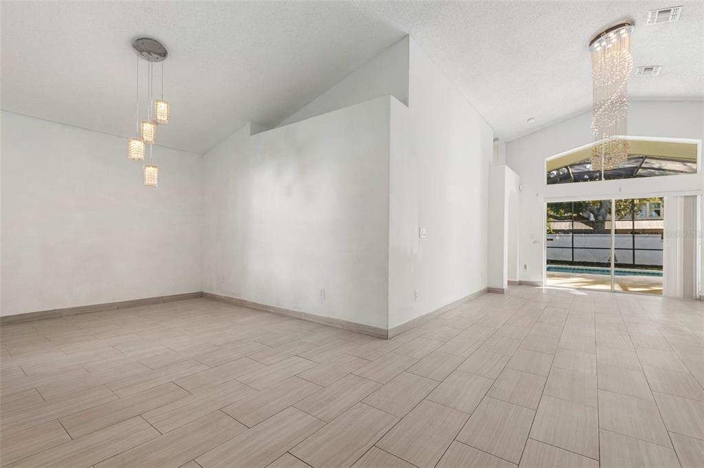 2627 Oneida Loop Kissimmee, FL 34747 - Photo 11 of 32 a view of an empty room with a window