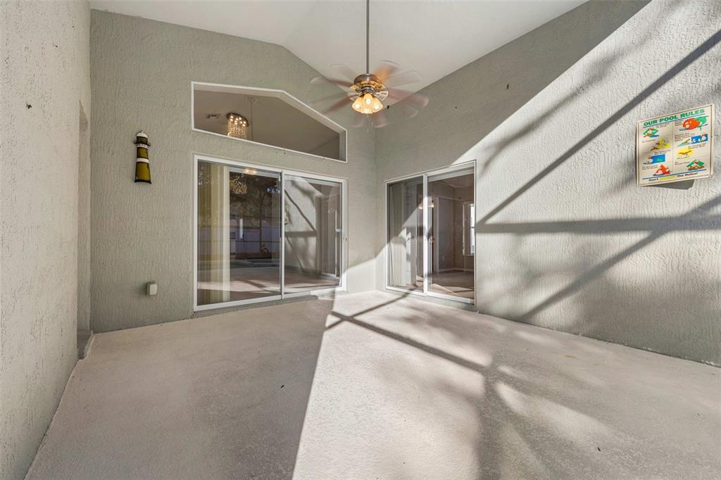 2627 Oneida Loop Kissimmee, FL 34747 - Photo 14 of 32 a view of an empty room with a window