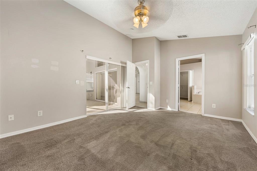 2627 Oneida Loop Kissimmee, FL 34747 - Photo 15 of 32 a view of an empty room with a window