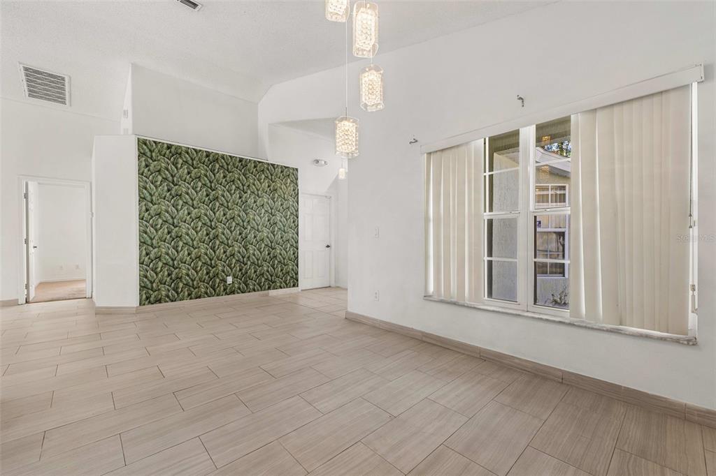 2627 Oneida Loop Kissimmee, FL 34747 - Photo 10 of 32 an empty room with windows and closet