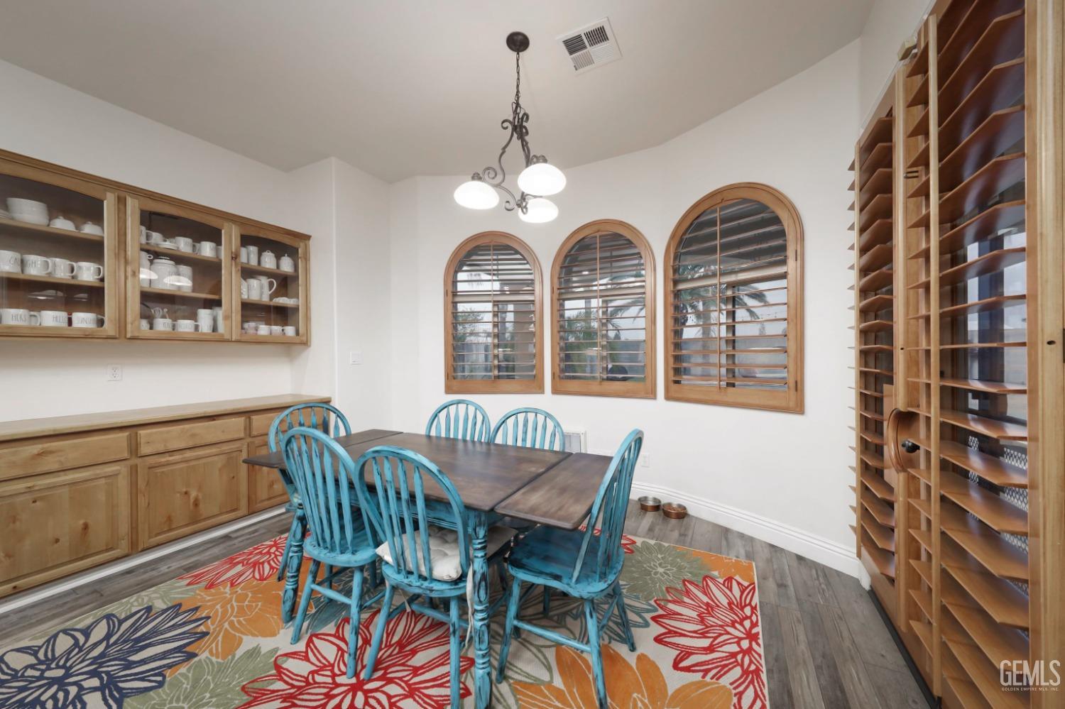 Undisclosed Address Bakersfield, CA 93312 - Photo 11 of 36 a view of a dining room with furniture and chandelier