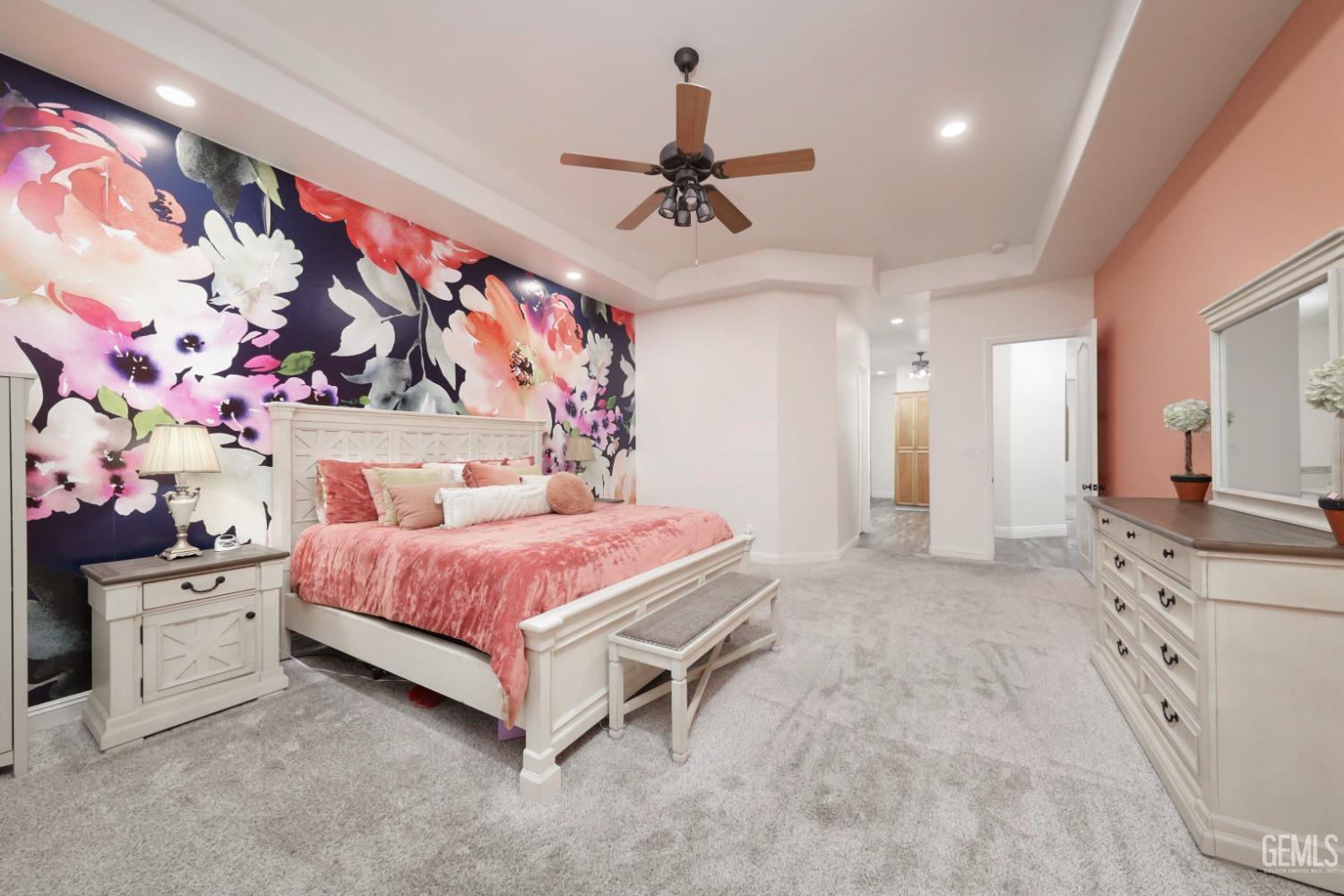 Undisclosed Address Bakersfield, CA 93312 - Photo 14 of 36 a spacious bedroom with a bed and a chandelier