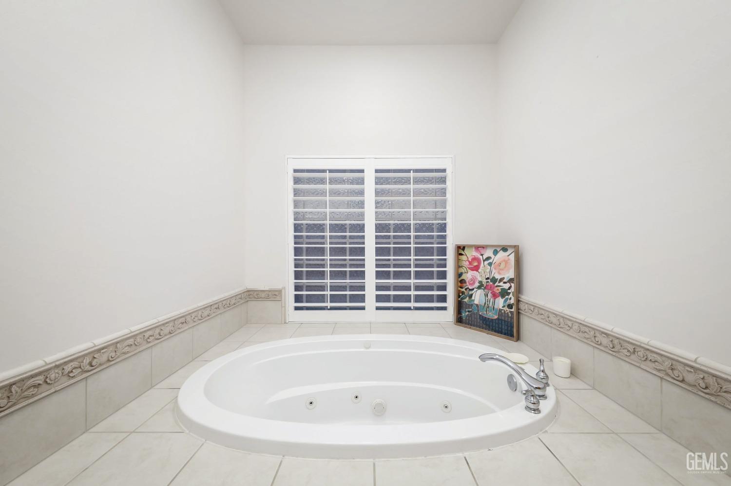 Undisclosed Address Bakersfield, CA 93312 - Photo 16 of 36 a bathroom with a bathtub